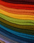 Fabric detail close up of stacked Ribbed Beanies in an array of colors
