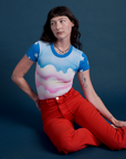Alex is 5’8” and wearing P Airbrush Cloud Baby Tee paired with mustang red Work Pants