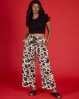 Kandia is 5'3" and wearing XS Cow Drop Pocket Pant with the Black Cropped Baby Tee