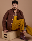 Jesse is wearing Ripstop Field Coat in Fudgesicle Brown