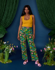 Kandia is 5'3" and wearing XS Work Pants in Pond Party paired with mustard yellow Cropped Tank
