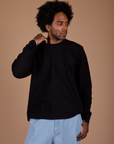 Jerrod is 6’3” and wearing M Long Sleeve Burly Tee in Basic Black
