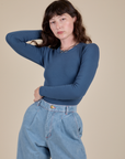 Alex is 5’8” and wearing P Long Sleeve Baby Tee in French Blue