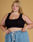 Juliet is 5’7” and wearing L Contrast Stitch Mini Tank in Basic Black