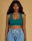 Kandia is 5’3” and wearing P Contrast Stitch Mini Tank in Hunter Green