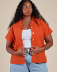 Meghna is 5’8” and wearing M Pantry Button-Up in Chili Red