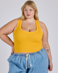 Juliet is 5’7” and wearing L Cropped Tank Top in Sunshine Yellow