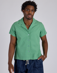 Isaac is 5’10” and wearing M Pantry Button-Up in Seafoam Green