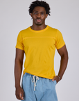 Isaac is 5’10” and wearing M Jr. Varsity Tee in Sunshine Yellow