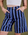 Front close up of Longline Work Shorts in Cornflower on Alex with both hands in the pockets
