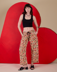 Alex is 5’8” and wearing XXS Hot Stuff Drop Pocket Cargo Pants paired with a black Cropped Tank