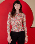 Alex is 5’8” and wearing P Long Sleeve Baby Tee in Hot Stuff Print