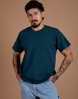 Jesse is 5'8" and wearing S Burly Tee in Lagoon
