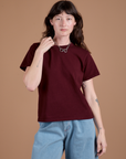 Alex is 5'8" and wearing P Burly Tee in Red Wine