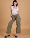 Alex is 5’8” and wearing XXS Corduroy Drop Pocket Cargo Pants in Khaki Grey paired with a Cropped Tank in Vintage Tee White
