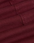 Drop Pocket Cargo Pants in Red Wine fabric detail close up