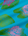 Paintstamped Pantry Button-Up in Lilypad close up. Green lilypads with pink flowers
