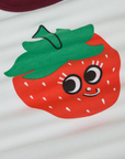 Produce Raglan Tee in Strawberry close up. Illustrated strawberry character with smiley face