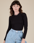 Alex is 5’8” and wearing P Long Sleeve Baby Tee in Basic Black