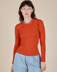 Alex is 5’8” and wearing P Long Sleeve Baby Tee in Chili Red