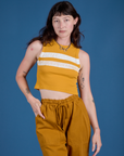 Alex is wearing Painted Muscle Tee in Mustard Yellow