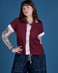 Sydney is wearing a buttoned up Painted Pantry Button-Up in Red Wine