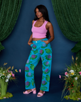 Angled front view of Paintstamped Work Pants in Lilypad and bubblegum Cropped Tank on Kandia