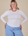Lish is 5’8” and wearing XS Long Sleeve Baby Tee in Vintage Tee Off-White