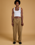 Jerrod is wearing Baggy Mid-Rise Trousers in Desert Brown and vintage tee white Cropped Tank