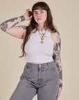 Sydney is 5’9” and wearing XXS Racerback Tank in Vintage Tee White