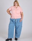 Juliet is wearing Pantry Button-Up in Baby Pink paired with light wash Denim Drop Pocket Pants