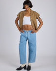 Kira is wearing Pantry Button-Up in Desert Brown and light wash Denim Drop Pocket Pants