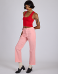 Angled front view of Work Pants in Baby Pink and mustang red Cropped Tank