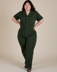 Ashley is wearing Short Sleeve Jumpsuit in Swamp Green