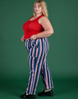 Side view of Work Pants in Pacific Stripe and mustang red Cropped Tank on Juliet