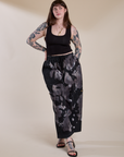 Sydney is wearing Magic Waters Drop Pocket Pants in Ink Blot and black Cropped Tank Top