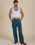 Jesse is wearing Work Pants in Lagoon paired with vintage tee white Cropped Tank