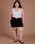 Ashley is wearing Classic Work Shorts in Basic Black and a Cropped Tank in Vintage Tee White