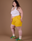 Side view of Classic Work Shorts in Sunshine Yellow and Cropped Tank in Vintage Tee White on Ashley
