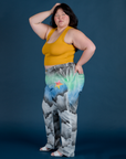 Side view of Work Pants in Night Sky Airbrush and mustard yellow Cropped Tank on Ashley