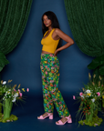 Side view of Work Pants in Pond Party and mustard yellow Cropped Tank on Kandia