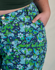 Close up of Juliet's hand in the front pocket of Work Pants in Angel Print