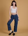 Mid-Rise Carpenter Jeans in Dark Wash and Cropped Tank in Vintage Tee White worn by Alex
