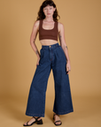 Alex is wearing Mini Tank in Fudgesicle Brown and dark wash Indigo Wide Leg Trousers