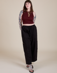Sydney is wearing Muscle Tee in Red Wineand black Drop Pocket Cargo Pants