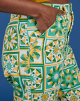 Close up of Kandia's hand in the front pocket of Work Pants in Spring Quilt Print