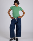 Kira is wearing Jr. Varsity Tee in Seafoam Green and dark wash Denim Drop Pocket Pants