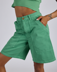 Angled front view close up of oLongline Work Shorts in Seafoam Green Kira