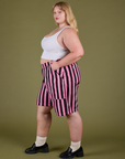 Side view of Longline Work Shorts in Bubblegum Pink and vintage tee white Cropped Tank