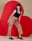 Side view of Hot Stuff Drop Pocket Cargo Pants and black Cropped Tank on Alex
